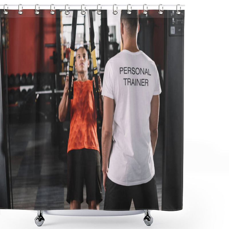 Personality  Back View Of Personal Trainer Standing Near Young African American Athlete Pulling Up On Suspension Trainer Shower Curtains