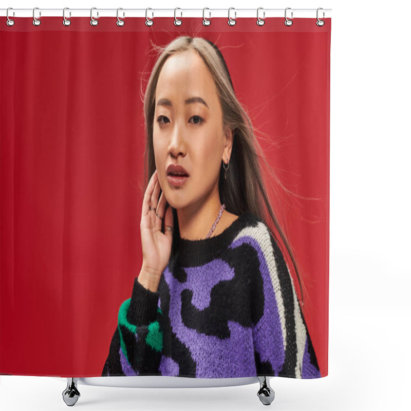 Personality  Attractive And Young Asian Woman With Dyed Hair In Vibrant Sweater With Animal Print Posing On Red Shower Curtains