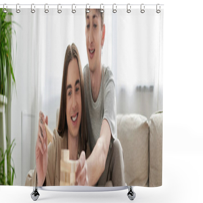 Personality  Young And Smiling Same Sex Couple In Casual Clothes Playing Blurred Wood Blocks Game Near Couch And Blurred Green Plants In Living Room At Home, Banner  Shower Curtains