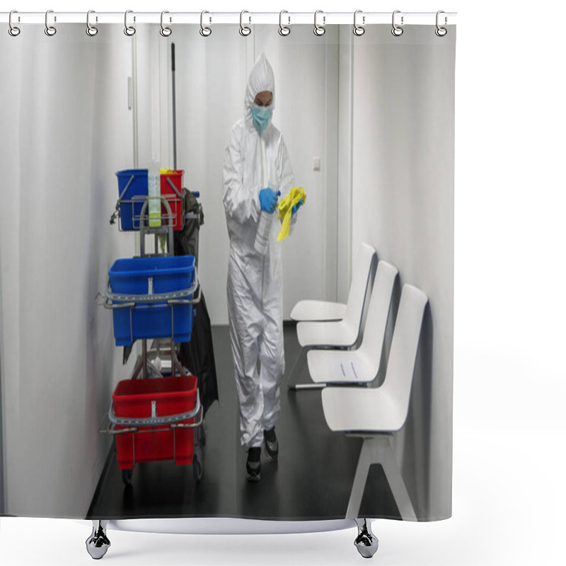 Personality  Alert Corona Virus Or Covid-19. Cleaner With Full Protective Suit, Masks And Gloves Cleans, Disinfects And Sanitizes The Waiting Room Of A Hospital, Clinic Or Ublic Place. Cleaning Of Chairs. Shower Curtains