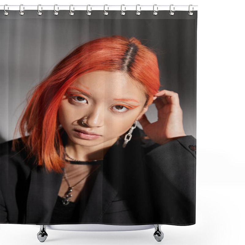 Personality  Portrait Of Young Asian Woman With Nose Piercing Looking At Camera And Adjusting Red Hair On Grey Shower Curtains