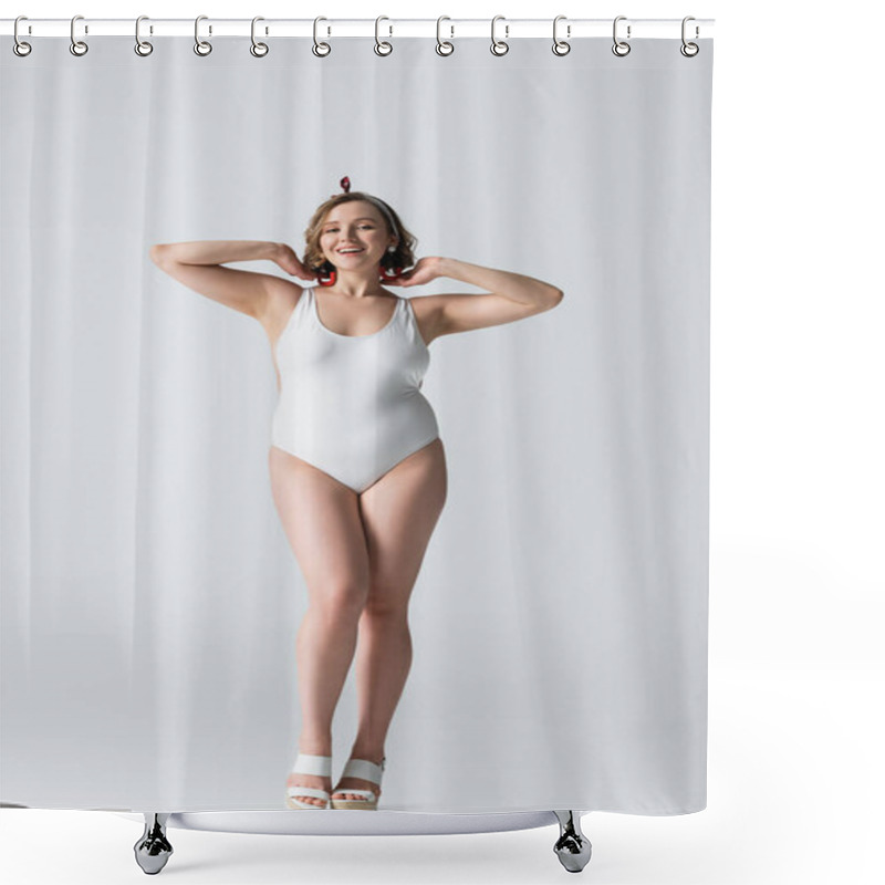 Personality  Full Length Of Cheerful Overweight Young Woman In Swimwear And Earrings Smiling While Posing On White Shower Curtains