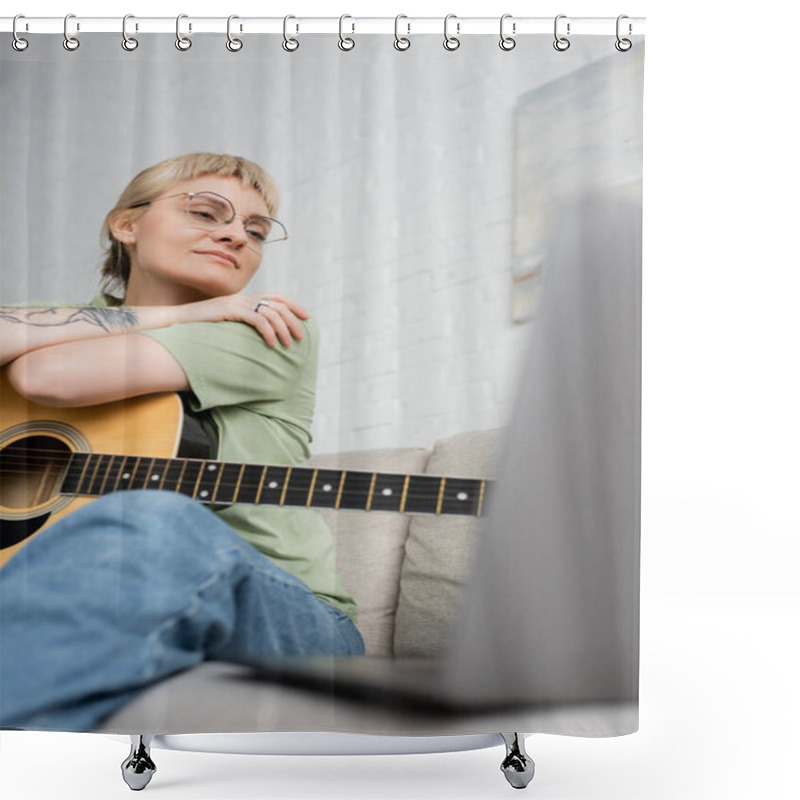 Personality  Pleased Young Woman In Glasses With Bangs And Tattoo Holding Acoustic Guitar And Looking Video Tutorial On Laptop While Sitting On Comfortable Couch In Modern Living Room At Home, Digital Resources  Shower Curtains