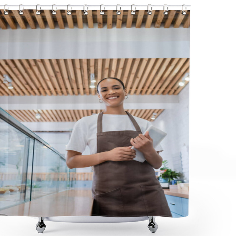 Personality  Low Angle View Of Cheerful African American Seller Holding Digital Tablet Near Showcase In Confectionery  Shower Curtains