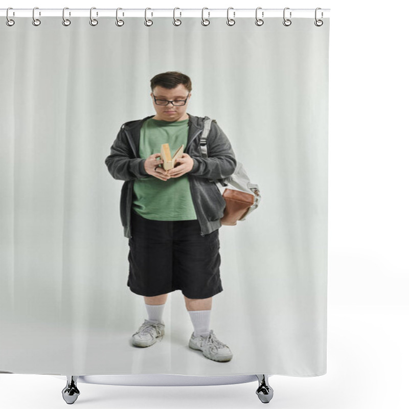 Personality  A Young Man With Down Syndrome Reads A Book While Standing Comfortably At Home. Shower Curtains