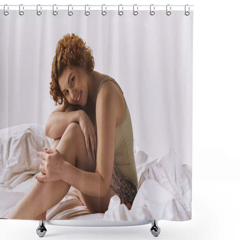 Personality  A Young Curvy Redhead Woman In Lingerie Sits Crossed-legged On A Bed Against A Grey Background. Shower Curtains