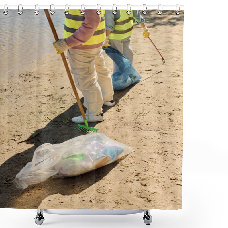 Personality  A Diverse Couple Stands Atop A Sandy Beach, United In Their Care For The Environment As They Clean Up Together. Shower Curtains