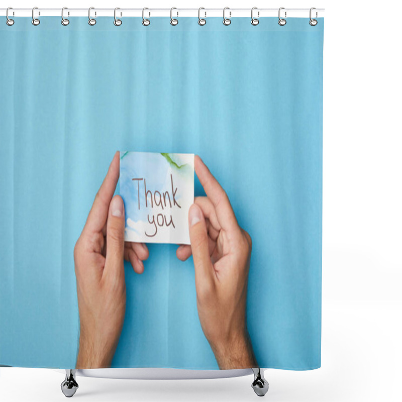 Personality  Partial View Of Man Holding Greeting Card With Thank You Lettering On Blue Background Shower Curtains