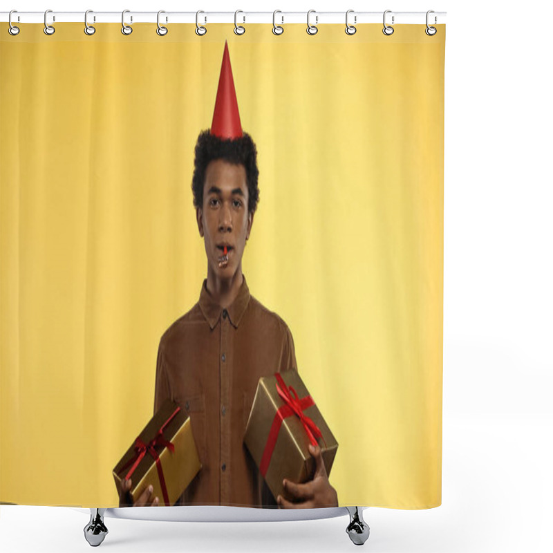 Personality  African American Teenager In Party Cap Holding Gift Boxes Isolated On Yellow Shower Curtains