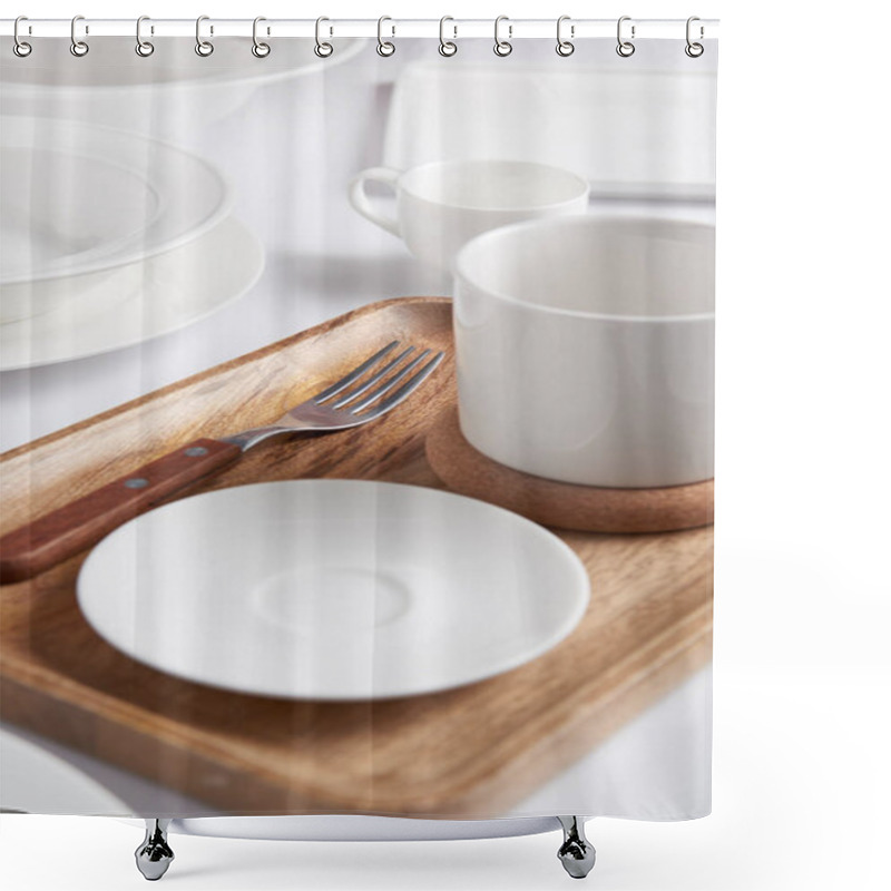 Personality  Selective Focus Of Wooden Tray, Fork, Various Plates, Cup And Bowl On White Table Shower Curtains