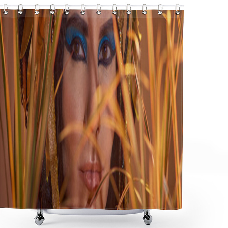 Personality  Woman With Makeup And Egyptian Headdress Looking At Camera Behind Plants Isolated On Brown, Banner Shower Curtains