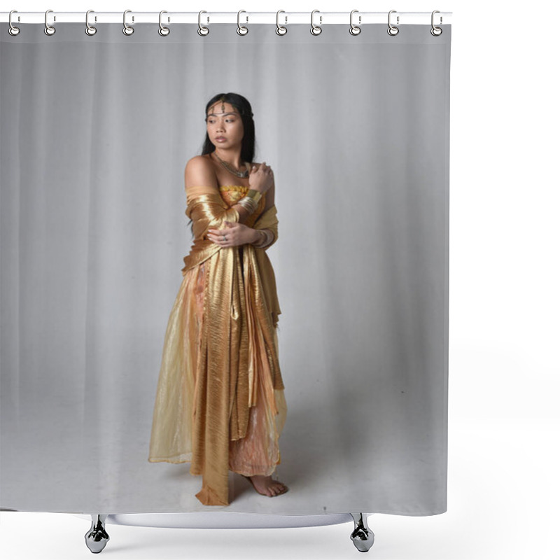 Personality  Full Length Portrait Of Pretty Young Asian Woman Wearing Golden Arabian Robes Like A Genie, Standing Pose Holding Flowing Fabric, Isolated On Studio Background. Shower Curtains