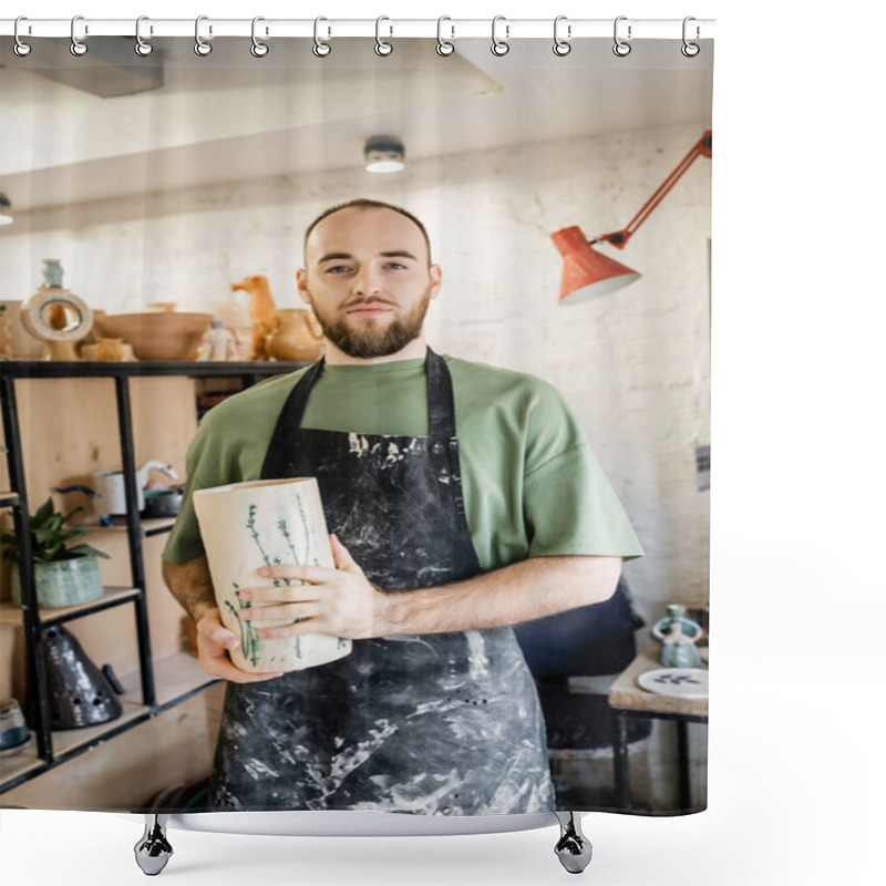 Personality  Bearded Craftsman In Apron Holding Ceramic Vase While Standing And Looking At Camera In Workshop Shower Curtains