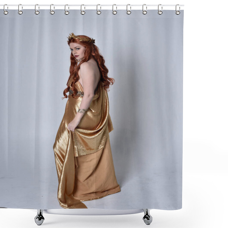 Personality  Full Length Portrait Of Girl With Red Hair Wearing Long Grecian Toga And Golden Wreath. Standing Pose With Back To The Camera,  Isolated Against A Grey Studio Background. Shower Curtains