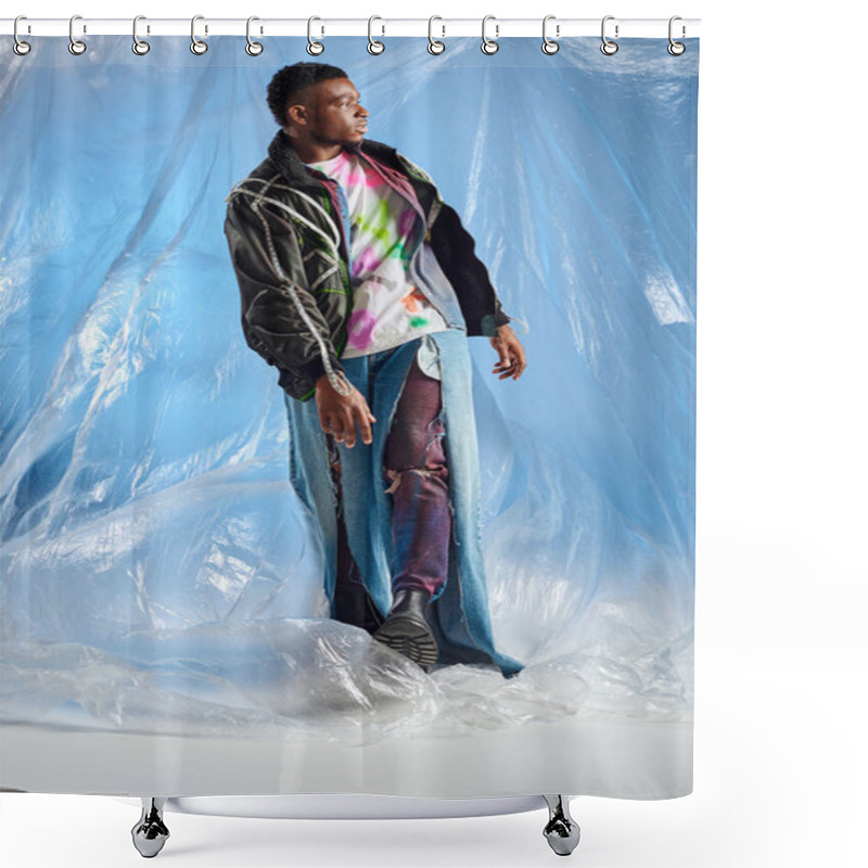 Personality  Fashionable Afroamerican Man In Outwear Jacket With Led Stripes And Ripped Jeans Walking On Glossy Cellophane On Blue Background, Urban Outfit And Modern Pose, DIY Clothing, Sustainable Lifestyle  Shower Curtains