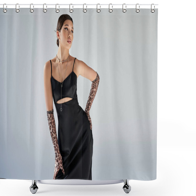 Personality  Spring Style, Expressive Asian Woman With Brunette Hair And Bold Makeup Standing With Hand On Hip In Black Elegant Strap Dress, Animal Print Gloves And Silver Necklaces On Grey Background Shower Curtains