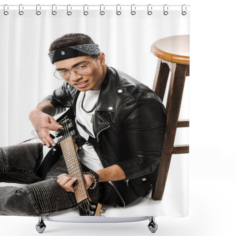 Personality  Joyful Young Male Rock Musician In Leather Jacket Playing On Electric Guitar While Sitting On Floor Near Chair Isolated On White Shower Curtains