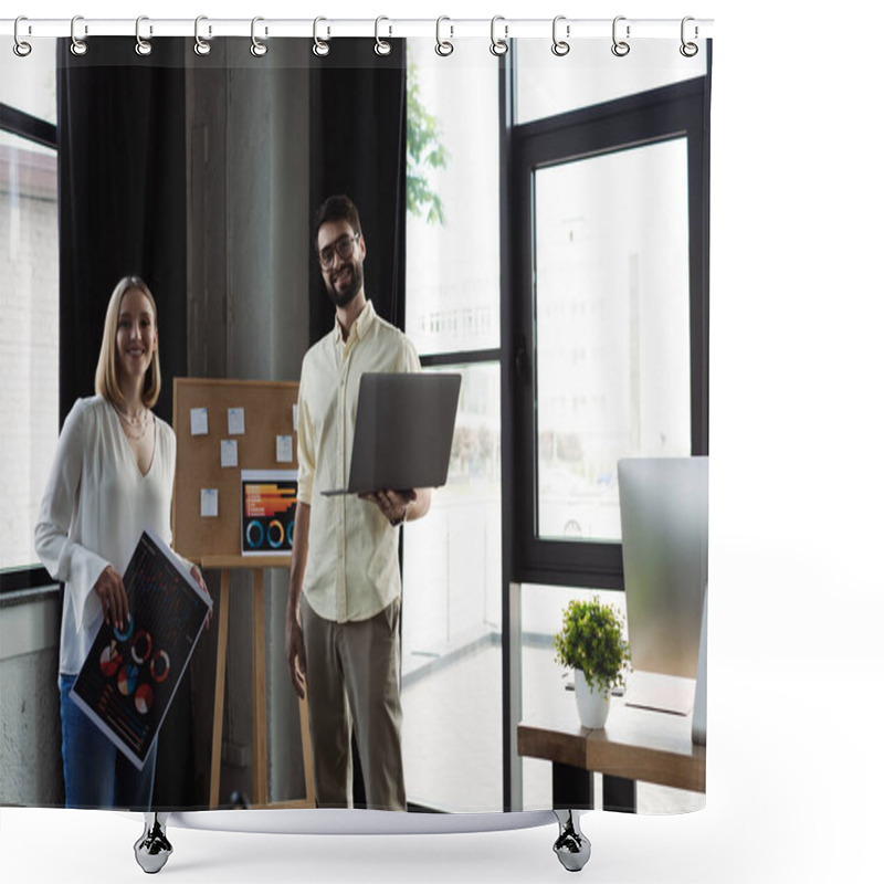 Personality  Smiling Manager Holding Laptop And Looking At Camera Near Intern With Charts In Office  Shower Curtains