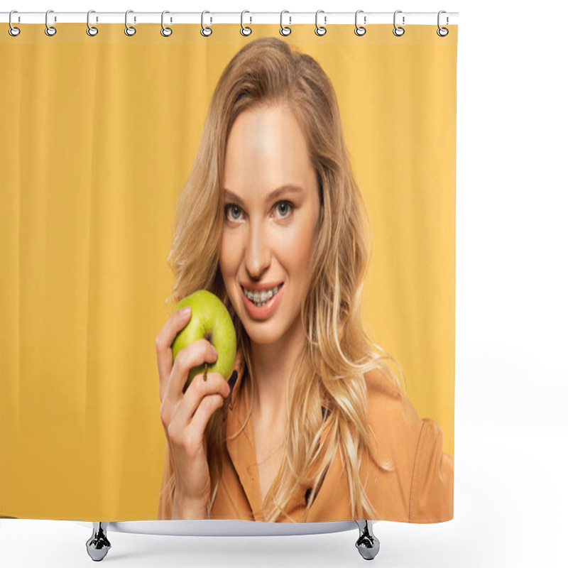 Personality  Smiling Blonde Woman With Dental Braces Holding Green Apple Isolated On Yellow Shower Curtains