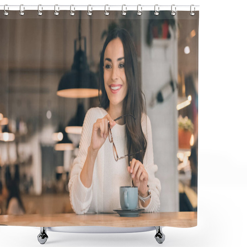 Personality  Smiling Young Woman Holding Eyeglasses While Sitting At Table With Coffee Cup In Cafe Shower Curtains