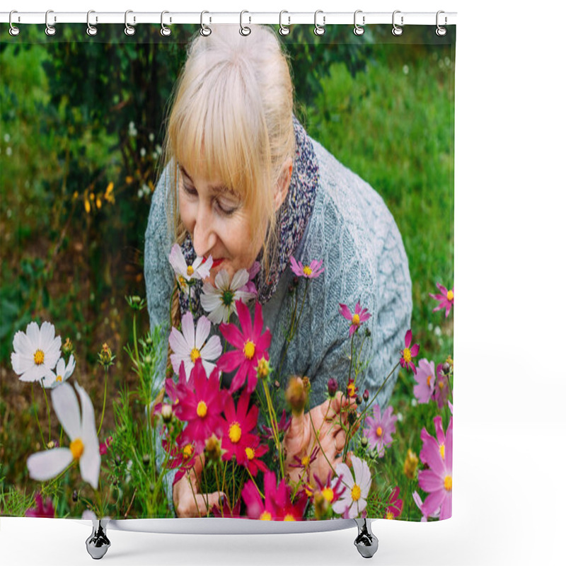 Personality  Attractive Blonde Woman Pensioner In A Gray Cardigan Sniffs Blooming Cosmos In The Summer In The Garden Shower Curtains