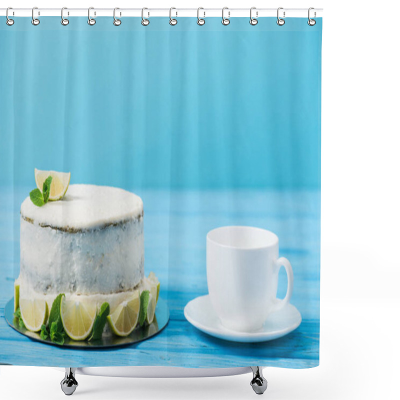 Personality  Cake Decorated With Slices Of Lime Near Tea Cup Isolated On Blue Shower Curtains