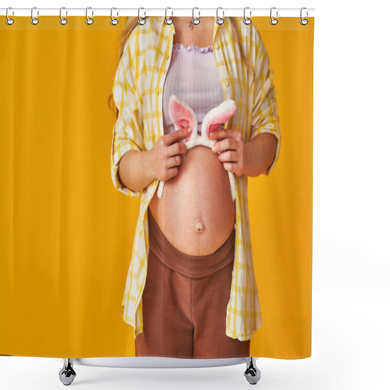 Personality  Close-up, Pregnant Blonde Wearing Bunny Ears On Her Stomach On Easter Day On Yellow Background. Expectant Mother Puts Her Hand On Her Stomach And Prepares For Holiday. Woman Expecting Child In Spring. Shower Curtains