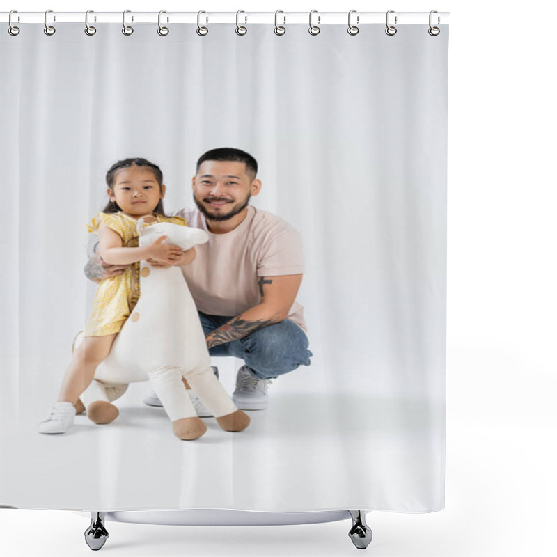 Personality  Full Length Of Happy Asian Kid Holding Toy Giraffe And Standing Near Tattooed Father On Grey Shower Curtains