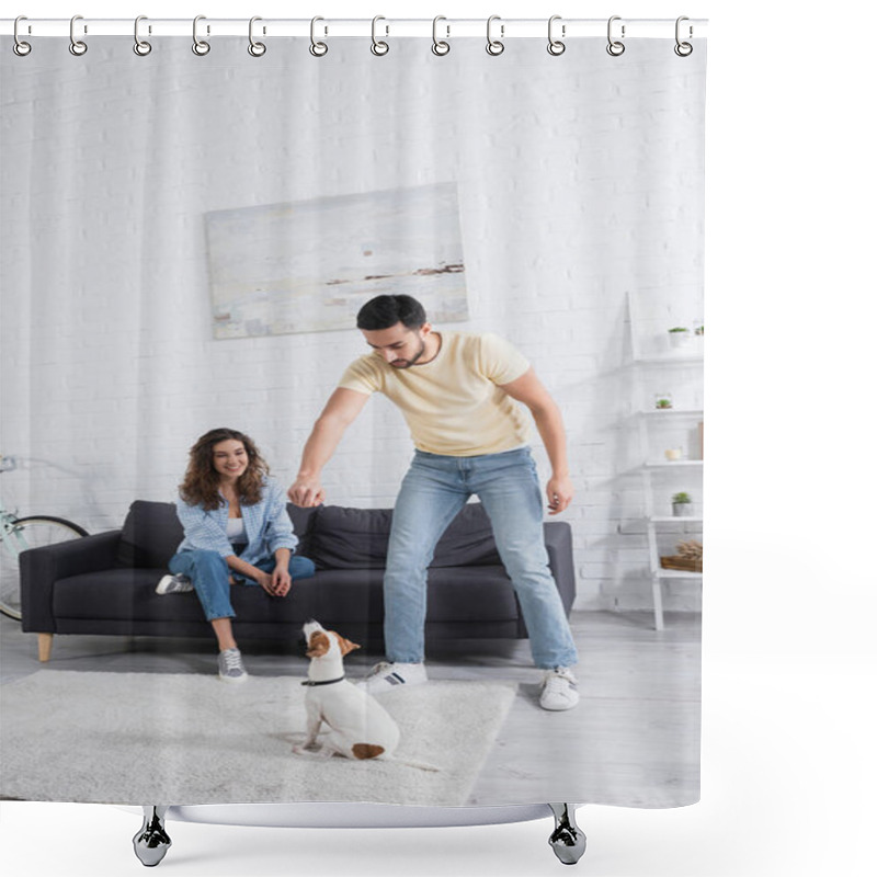 Personality  Muslim Man Holding Pet Food Above Jack Russell Terrier Near Cheerful Girlfriend On Sofa Shower Curtains