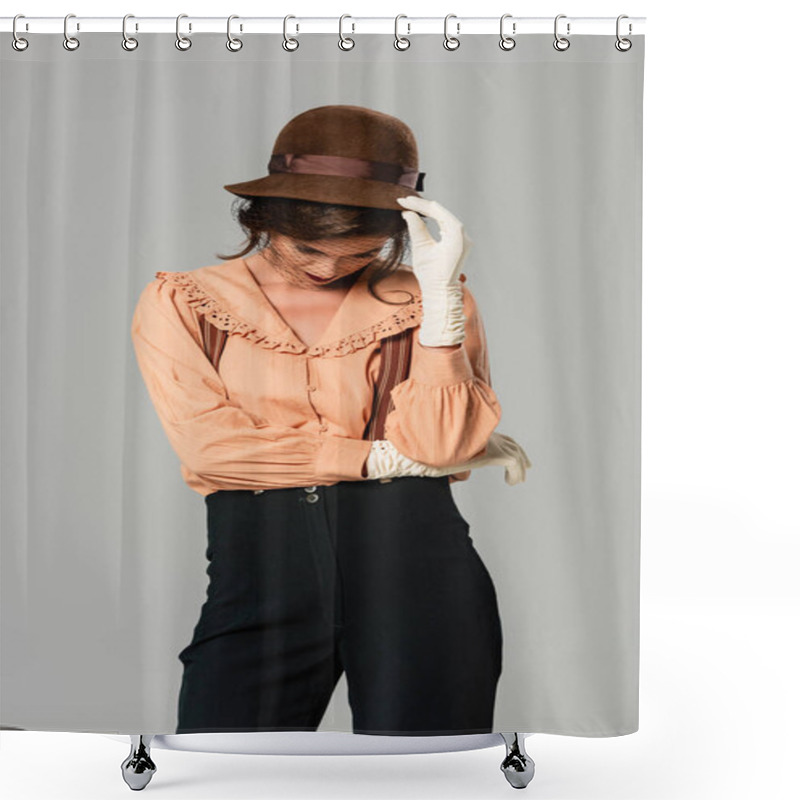 Personality  Young Woman In Retro Clothes Touching Hat While Standing With Bowed Head Isolated On Grey Shower Curtains