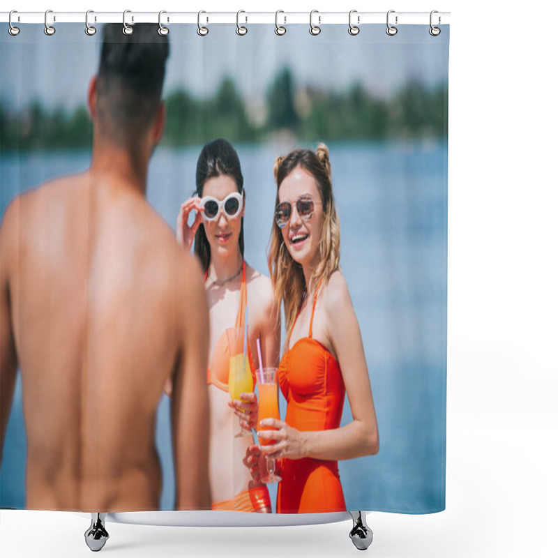 Personality  Selective Focus Of Girls In Swimwear Holding Cocktails And Looking At Young Man On Beach Shower Curtains