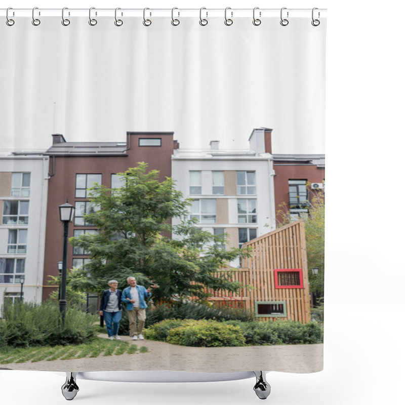 Personality  Mature Man And Woman Walking Near New Buildings Outside  Shower Curtains