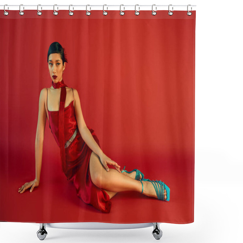 Personality  Trendy Spring Concept, Full Length Of Mesmerizing Asian Fashion Model With Brunette Hair And Bold Makeup, In Strap Dress, Neckerchief And Turquoise Sandals Sitting And Looking Away On Red Background Shower Curtains