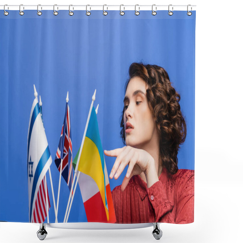 Personality  Brunette Woman Pointing At Different Flags While Choosing Language To Study Isolated On Blue Shower Curtains