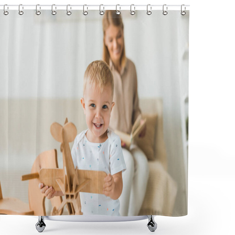 Personality  Happy Toddler Playing With Toy Wooden Toy Plane In Nursery Room With Mother On Background Shower Curtains