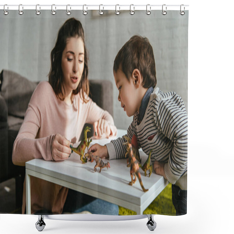 Personality  Cheerful Woman And Little Son Playing Toy Dinosaurs At Table In Living Room At Home Shower Curtains