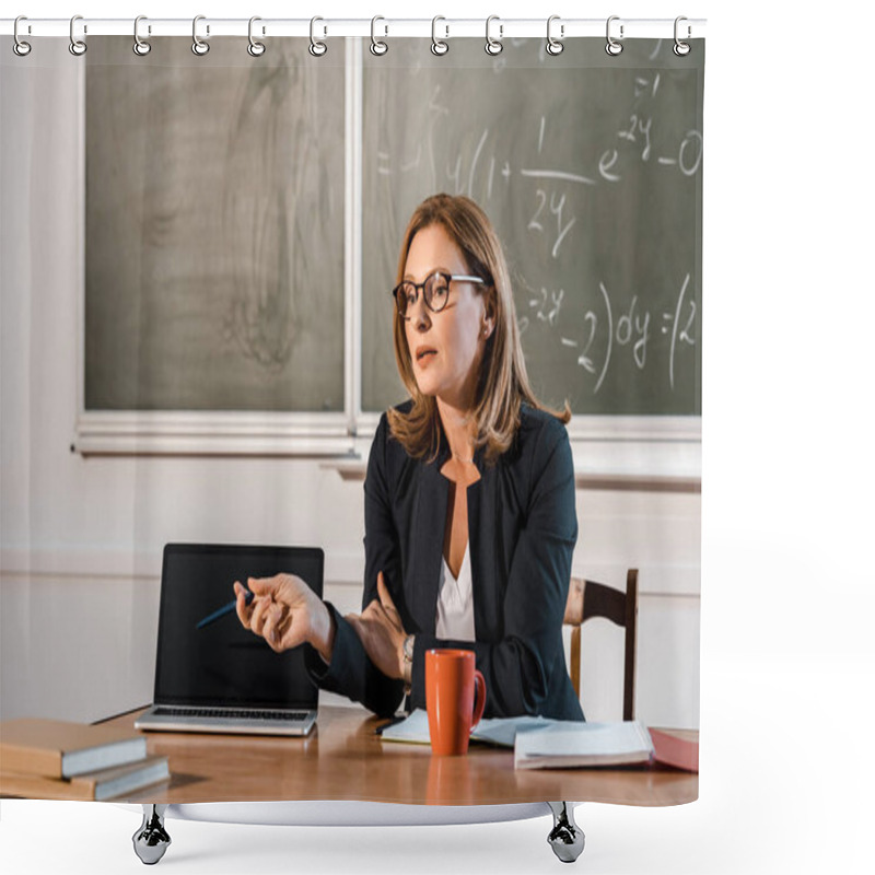 Personality  Female Teacher Sitting At Desk And Pointing At Laptop With Blank Screen In Classroom Shower Curtains