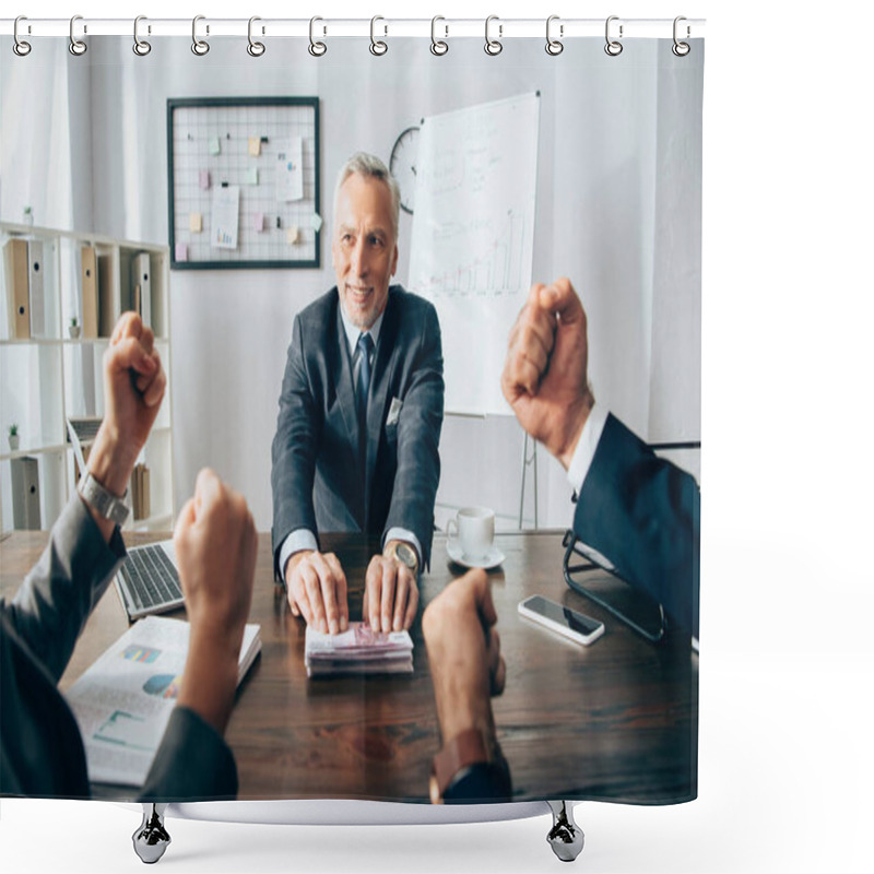 Personality  Smiling Businessman Holding Money Near Partners Showing Yeah Gesture On Blurred Foreground  Shower Curtains