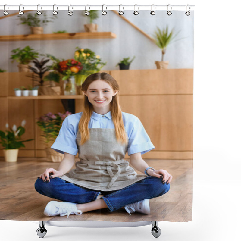 Personality  Beautiful Young Woman In Apron Sitting On Floor And Smiling At Camera In Flower Shop  Shower Curtains