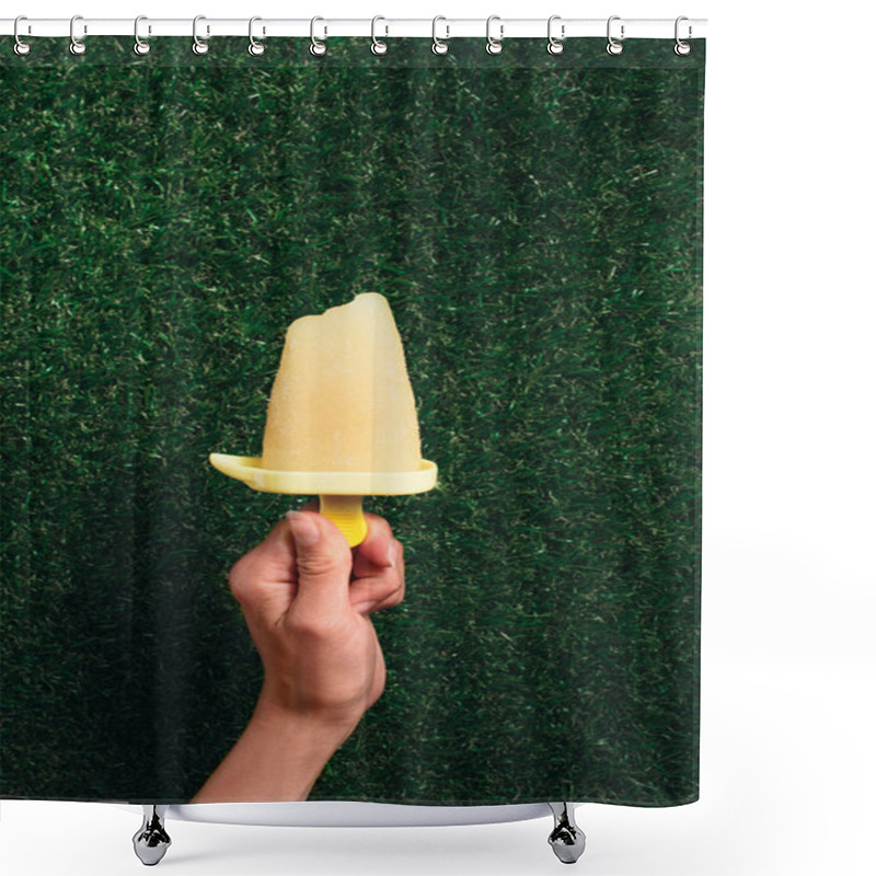 Personality  Hand Holding Delicious Popsicle On Green Grass Background Shower Curtains