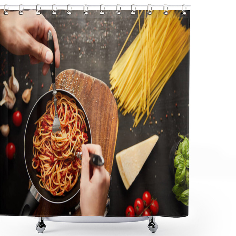 Personality  Cropped View Of Couple Eating Tasty Bolognese Pasta From Frying Pan Near Ingredients On Black Wooden Background Shower Curtains