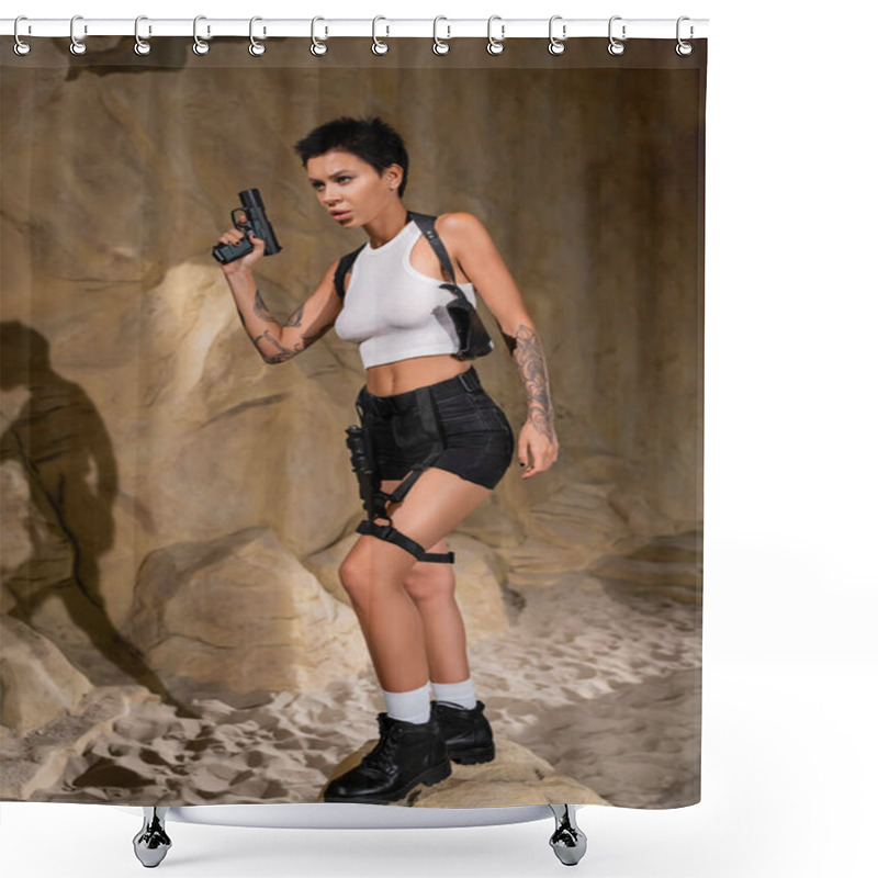 Personality  Full Length Of Sexy And Concentrated Archaeologist In Crop Top And Shorts Holding Gun While Standing On Stone Shower Curtains