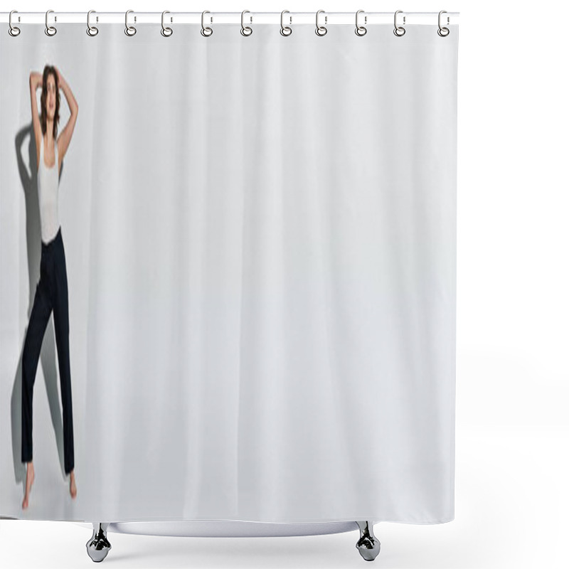 Personality  A Pretty Young Woman In Black Pants And White Tank Top Stands Confidently In Front Of A Plain White Wall In A Studio Setting. Shower Curtains