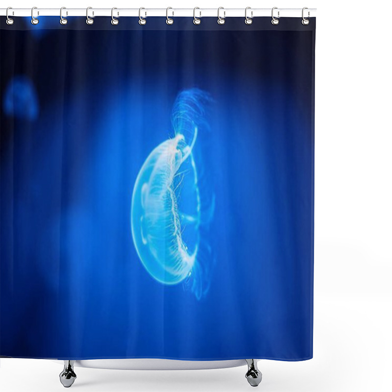 Personality  A Glowing Jellyfish Floats Gracefully Through The Deep Blue Ocean, Its Bioluminescent Body Pulsating Softly. This Captivating Scene Showcases The Mysterious Beauty Of Marine Life In The Depths. Shower Curtains