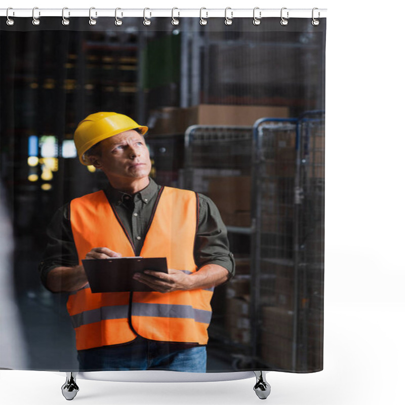 Personality  Thoughtful Middle Aged Supervisor In Hard Hat Reviewing Paperwork In Warehouse, Logistics And Cargo Shower Curtains