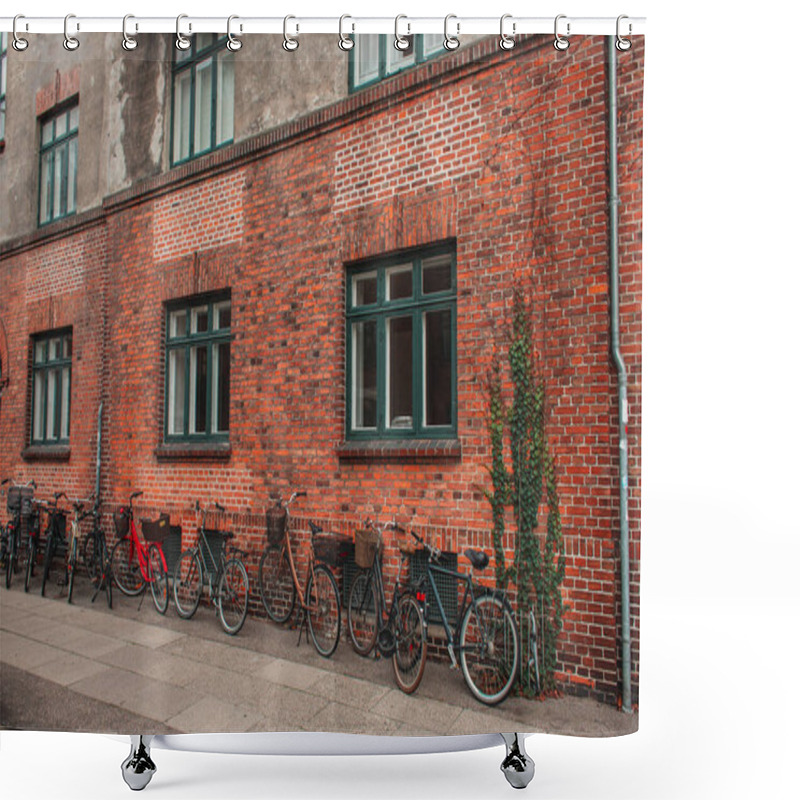 Personality  Row Of Bikes Near Brick Facade Of Building On Urban Street, Copenhagen, Denmark  Shower Curtains