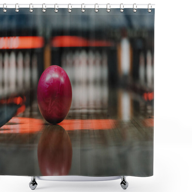 Personality  Close-up Shot Of Red Bowling Ball Lying On Alley Under Warm Light Shower Curtains