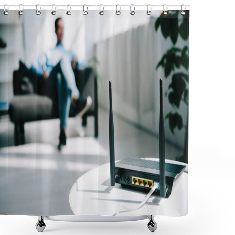 Personality  Selective Focus Of Black Plugged Router On White Table And Businessman Sitting On Sofa Shower Curtains