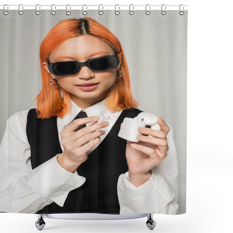 Personality  Red Haired And Youthful Asian Woman In Dark Stylish Sunglasses Holding Case With Wireless Earphones On Grey Background, White Shirt, Black Tie And Vest, Business Casual Fashion, Generation Z Shower Curtains