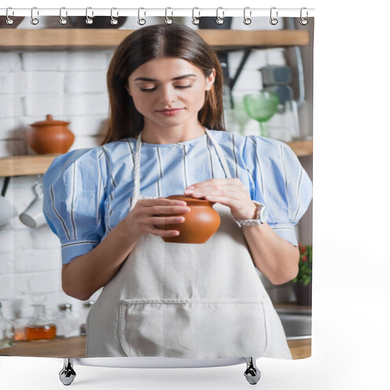 Personality  Cheerful Young Adult Woman In Apron Holding Clay Pot In Hands In Kitchen Shower Curtains